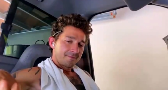 Shirtless in a car parked in a garage