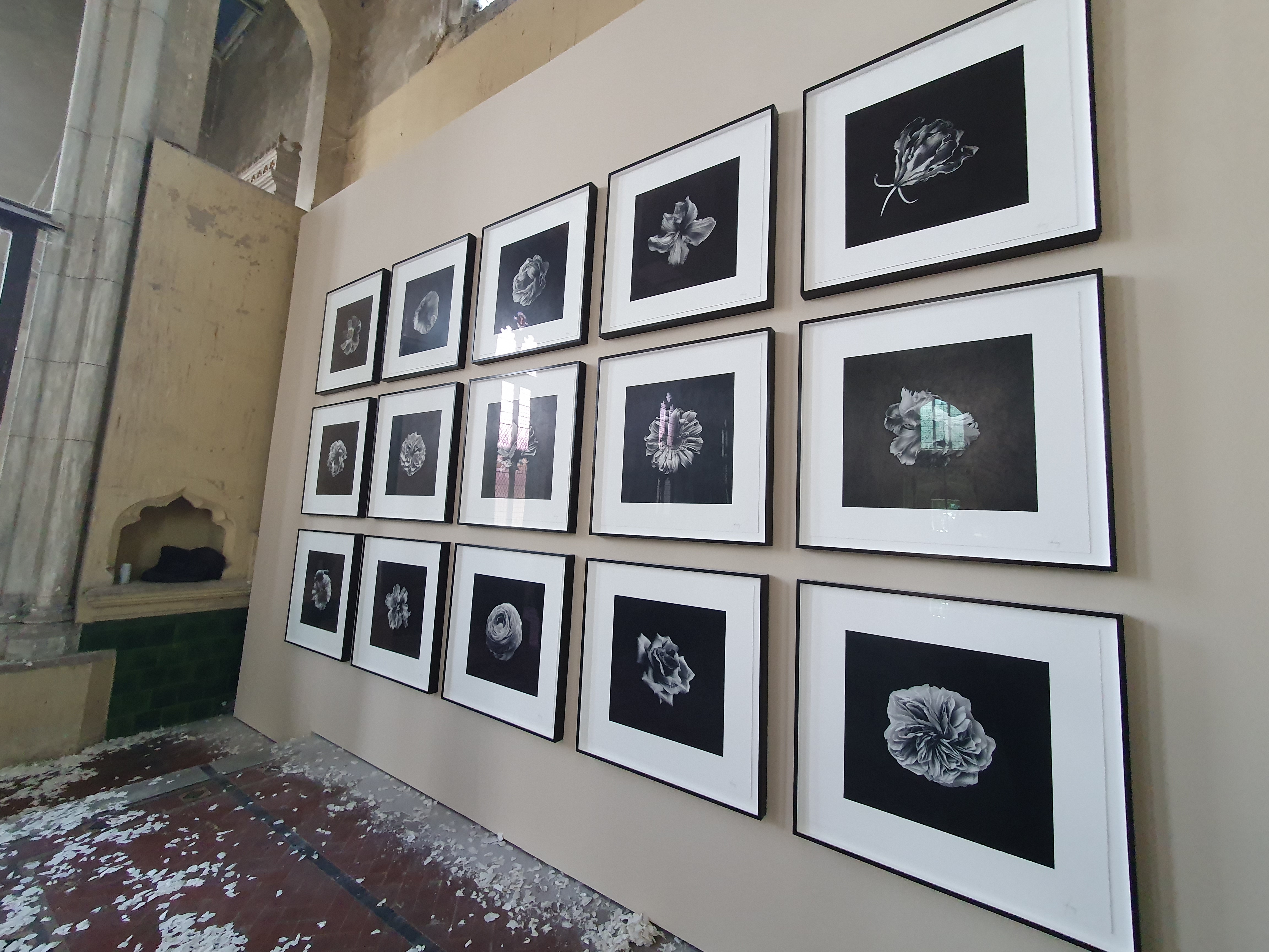 Black and white floral artworks were hanging on the back wall of the church