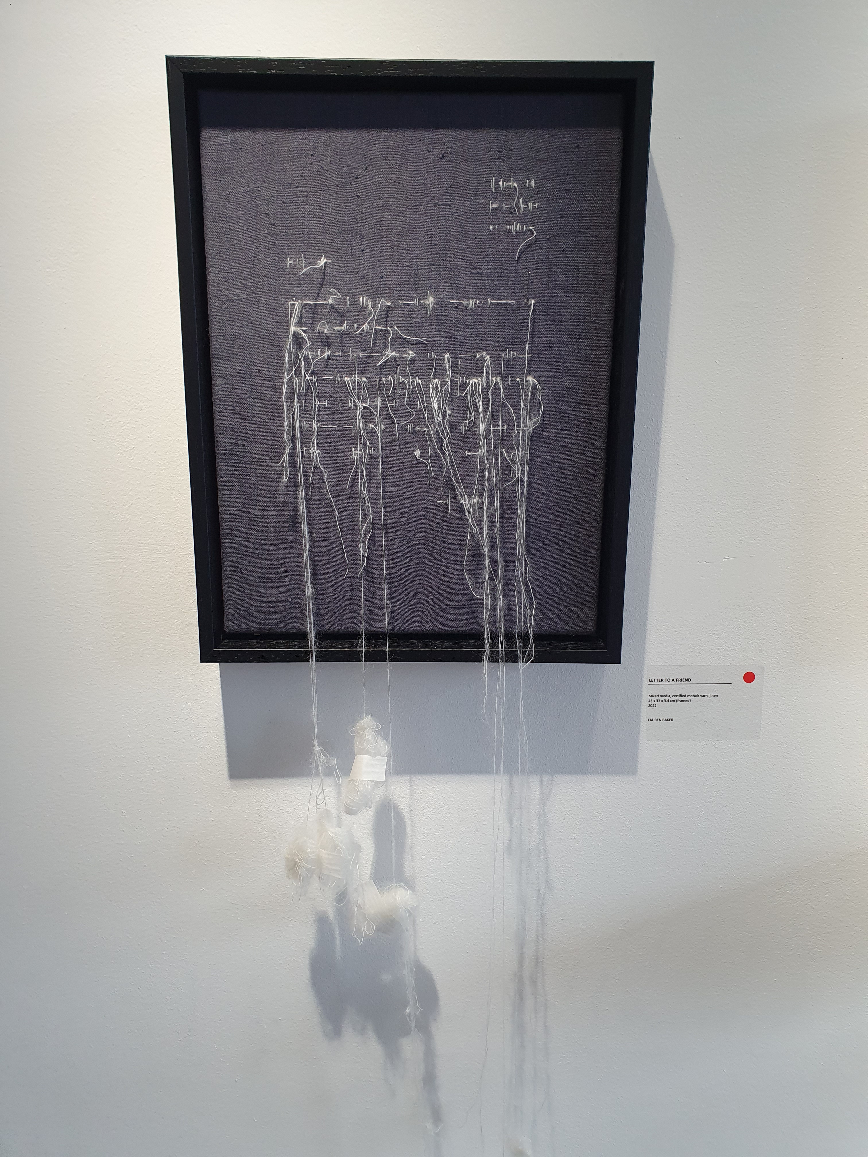 Letter to a Friend has a feeling of fragility as the snowy white mohair yarn tumbles down from the stormy grey sky coloured canvas