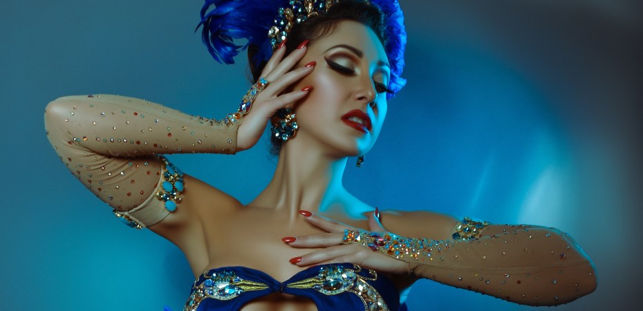 Miss Jolie Papillon wears a sparkly peacock type outfit